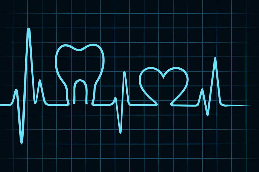Tamna pozadina sa stiliziranom svijetlom crtom kardiograma koja oblikuje profil jednog zuba i srca